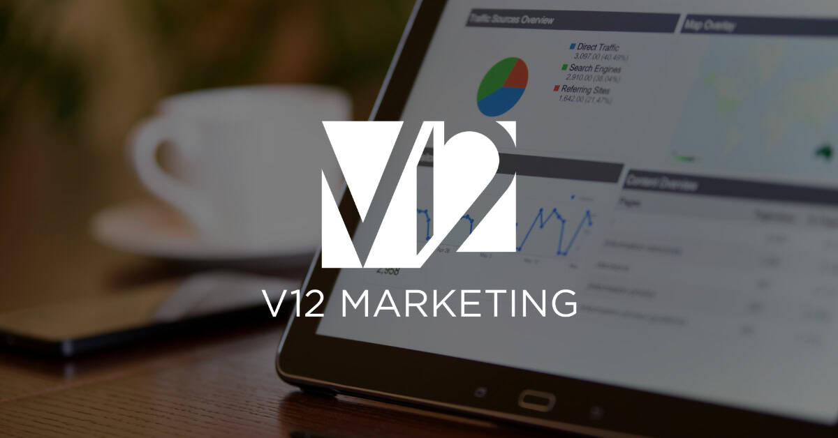 Marketing professional reviewing website analytics and technical SEO data on a laptop representing a technical SEO audit by V12 Marketing